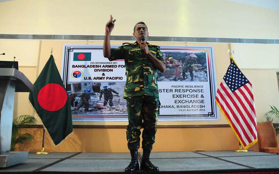 Col. Mohammad Tawhid-Ul-Islam of the Bangladesh Armed Forces Division delivers a presentation on the Dhaka City Earthquake Contingency Response Plan on Monday, Aug. 18, 2014, the opening day of the Pacific Resilience Disaster Relief Exercise and Exchange in Dhaka, Bangladesh.
