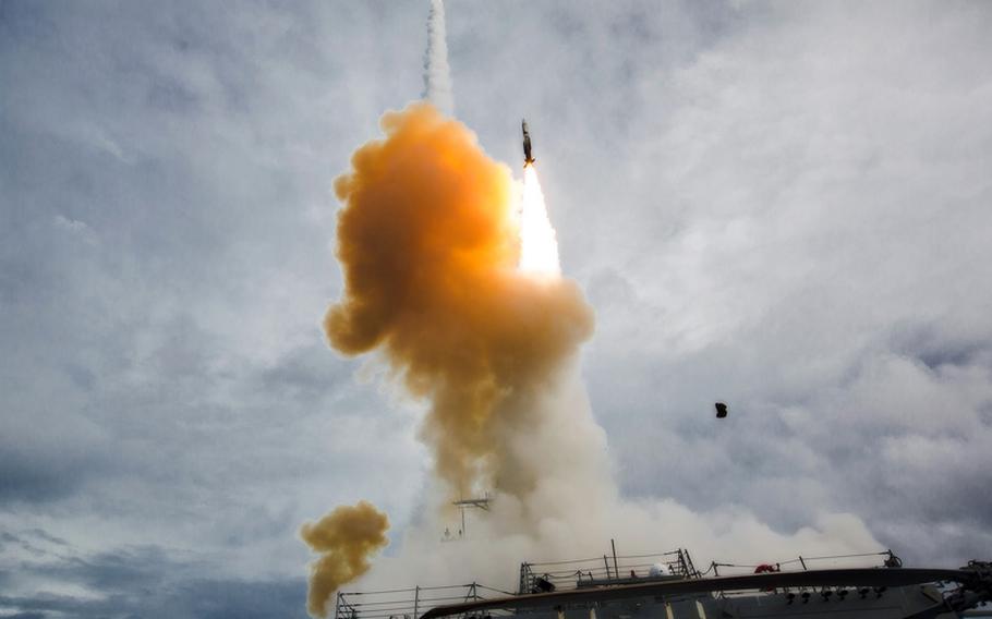 The Arleigh Burke-class guided-missile destroyer USS Mustin fires two SM-2 missiles during Exercise Valiant Shield 2014. Air and sea units from the U.S. Navy, Marine Corps and Air Force participated in the sinking exercise of ex-USS Fresno to gain proficiency in tactics, targeting and live firing against a surface target at sea in conditions that couldn't be simulated otherwise. 