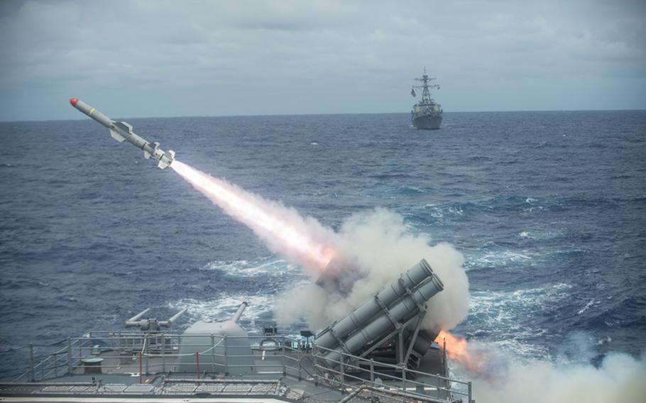 A Harpoon missile is launched from the Ticonderoga-class guided-missile cruiser USS Shiloh during a live-fire exercise. 