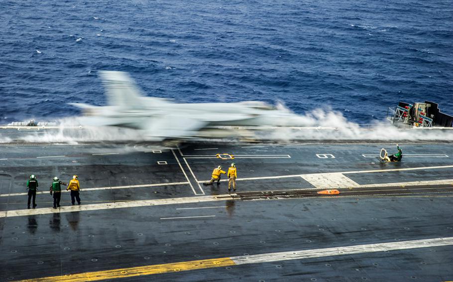 An F/A-18E Super Hornet from the Eagles of Strike Fighter Squadron 115 launches from the flight deck of the forward deployed aircraft carrier USS George Washington in anticipation of operations in a joint airspace environment during Valiant Shield 2014. 