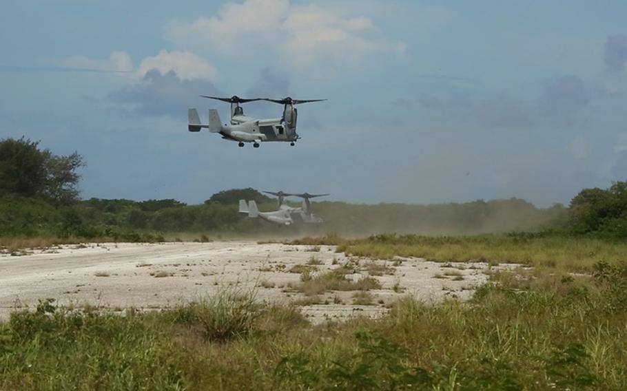 Two MV-22B Osprey tiltrotor aircraft containing Marine infantrymen land near Tinian's North Field Sept. 20 as part of the island seizure portion of Valiant Shield 2014. The Marines within the aircraft disembarked and the Osprey took off before the Marines made their way to reclaim a compound that has been captured by opposing forces, represented by Guam Army National Guard's Alpha Company, 1st Battalion, 294th Infantry Regiment. 

