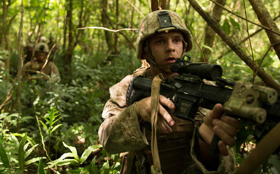 Marines assault an objective during the island seizure portion of Valiant Shield 2014 Sept. 20 near Tinian's North Field. Their objective is a compound held by an opposing force represented by  the Guam Army National Guard's Alpha Company, 1st Battalion, 294th Infantry Regiment.
