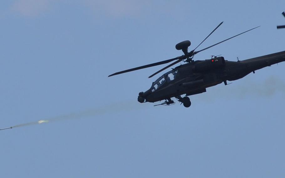 An Apache attack heliicopter fires a rocket during the final combined-arms live fire exercise of Garuda Shield in Indonesia, which winds up at the end of September.
