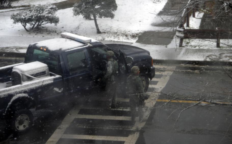Members of the 51st Security Forces Squadron block the road toward Osan Middle School and Osan American High School at Osan Air Base, South Korea on Dec. 1, 2014. An active shooter alert was announced approximately 10 a.m. this morning.