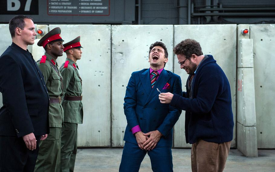 James Franco, center, as Dave, and Seth Rogen, right, as Aaron, in Columbia Pictures' "The Interview." 