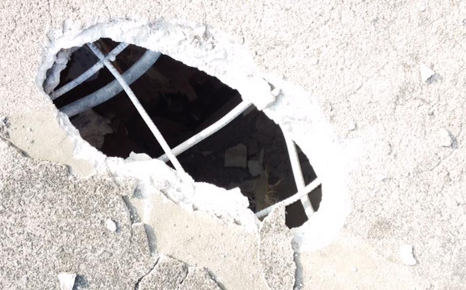 A 105mm round from Rodriguez Range punctured a hole, seen here, in the roof of a nearby home March 29, 2015. Rodriguez Range is about 15 miles south of the Korean Demilitarized Zone. Army officials are investigating the incident.