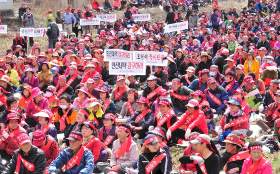 Demonstrators call for an end to accidents near the Rodriguez Range live-fire complex in Pocheon, South Korea, on April 3, 2015. On March 29, an errant 105mm shell exited the range and struck a nearby home. 