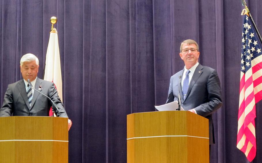 Japan Defense Minister Gen Nakatani, left, and U.S. Defense Secretary Ash Carter speak with reporters at the Japan Ministry of Defense in Tokyo on April 8, 2015. The nations are working on the final details of the 1st revision to their bilateral national defense guidelines since 1997.