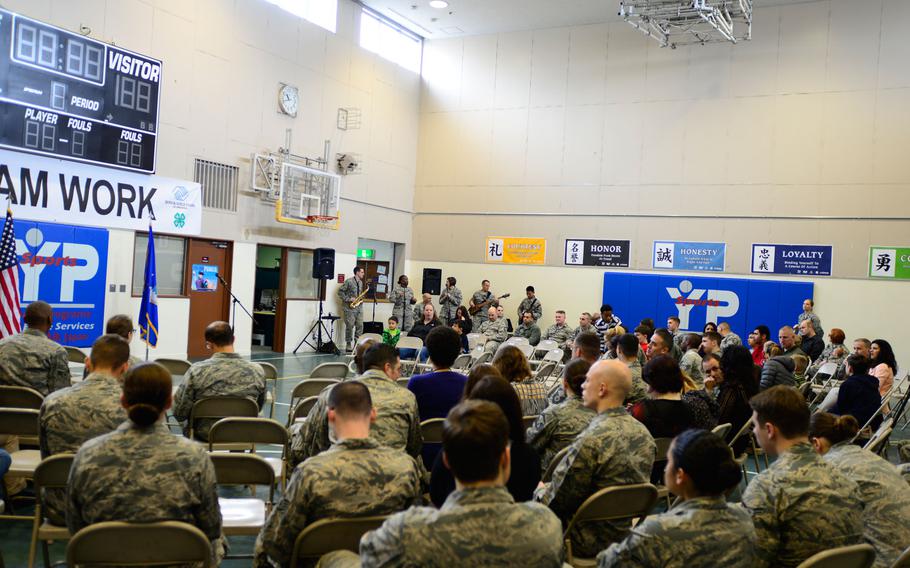 The Air Force band entertains the Yokota Air Base community before Secretary of Defense Ash Carter's arrival. The secretary's visit to Japan and South Korea is part of a group of planned trips to Asia this year.