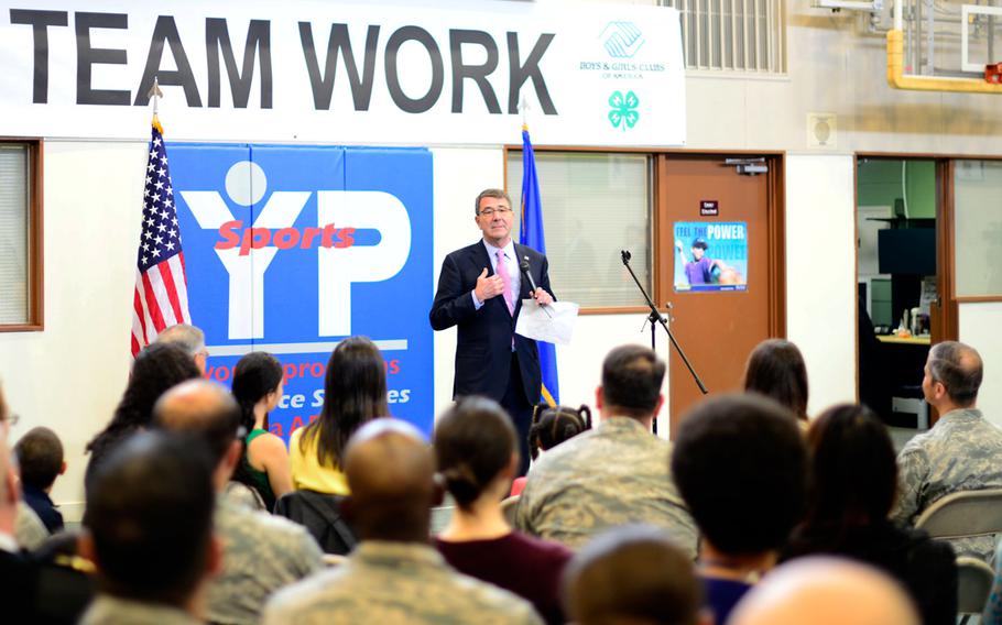 Defense Secretary Ash Carter addresses troops at Yokota Air Base, Japan, on Thursday, April 9, 2015, during his first swing through Asia as defense chief. A day earlier, he met his Japanese counterpart, Defense Minister Gen Nakatani, in Tokyo, where they announced expanded defense ties between the two countries.