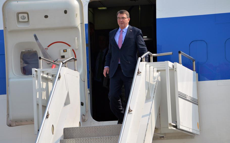 Defense Secretary Ash Carter departs his plane at Osan Air Base, South Korea on April 9, 2015. Carter begins first day of his two-day visit in Korea. 

