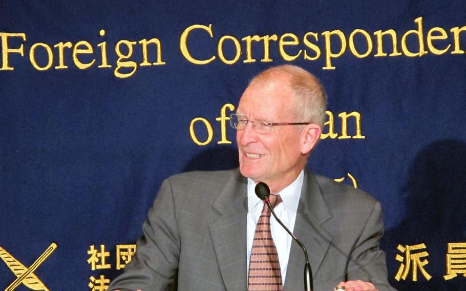Dennis Blair, retired admiral and former director of national intelligence, speaks with reporters in Tokyo on April 14, 2015. Blair stressed that cyberwarfare on a large scale between nations would likely have unintended consequences on civilians.