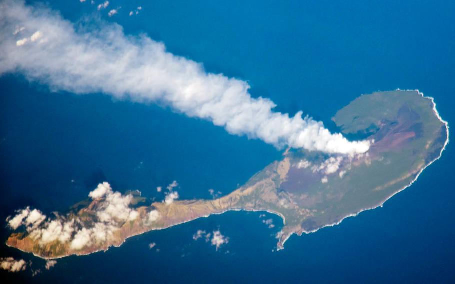 A plume rises from the volcano on the northern end of Pagan Island in this photo taken from the International Space Station on March 6, 2012.