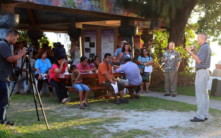 Tim Robert, lead operational planner at Marine Forces Pacific, speaks to local residents at an outdoor communal beach shelter on Saipan, Commonwealth of the Northern Mariana Islands, on April 12, 2013, during the last in a series of public meetings. At the meetings, government officials provided information, answered questions and sought public input on the preliminary alternatives proposed in the CNMI Joint Military Training environmental impact statement. 

