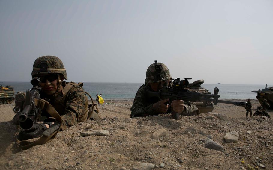 U.S. Marine Corps Kodi Irwin provides security during a beach landing exercise with a Republic of Korea Marines on BLA White Beach, Pohang, South Korea, March 29, 2015. The 31st MEU is currently participating in Korean Marine Exchange Program, a training exercise done by U.S. Marine and Navy forces with South Korean forces in order to strengthen working relationships across the range of military operations.