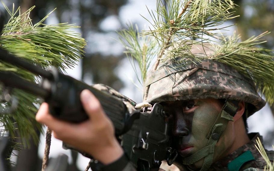 A Republic of Korea Marine provides security during a beach landing exercise with U.S. Marines on BLA White Beach, Pohang, South Korea, March 30, 2015. 