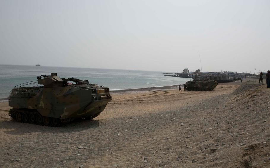 Republic of Korea Amphibious Assault Vehicles and U.S. Marines provide security during a beach landing exercise with ROK  Marines on BLA White Beach, Pohang, South Korea, March 29, 2015. 