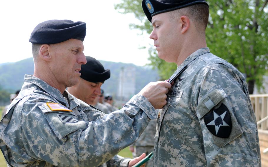 Maj. Richard E. Hull, right, receives the Soldier's Medal from Maj. Gen. Thomas S. Vandal, 2nd Infantry Division commander on April 23, 2015, in South Korea. Hull was awarded the highest peacetime medal for his actions in September 2014 in Nantucket, Massachusetts, when he and a friend risked their personal safety in aiding in the rescue of five people who had been ejected from a private boat.


