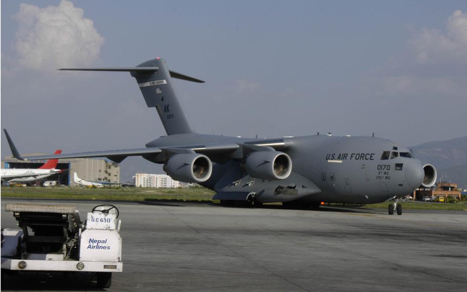 A U.S. C-17 transport plane arrives in Kathmandu Sunday, May 3, 2015, along with other U.S. aircraft as part of the U.S. military's contribution to earthquake relief efforts in Nepal. 

