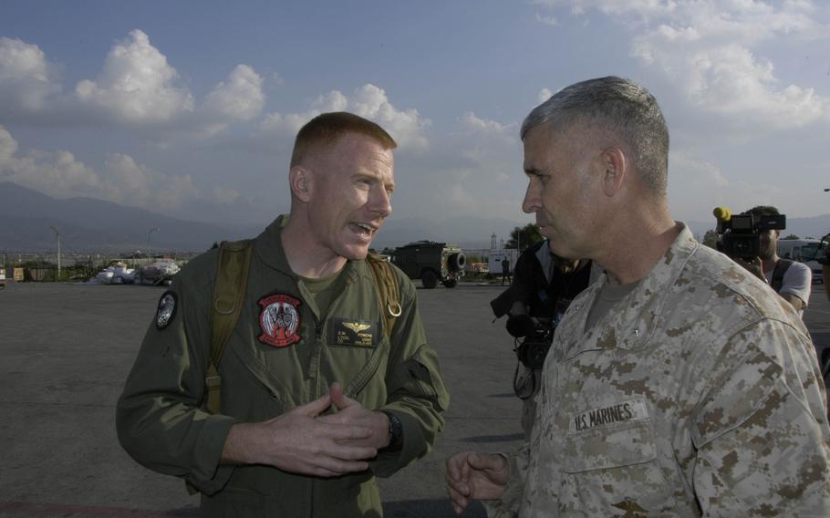 Marine Corps Light Attack Helicopter Squadron 469 commander Lt. Col. Edward Powers talks to Marine Brig. Gen. Paul Kennedy in Kathmandu on Sunday, May 3, 2015. Kennedy, the 3rd Marine Expeditionary Brigade commander, arrived in the Nepalese capital a few days earlier with an advance party of Pacific Command troops. 
