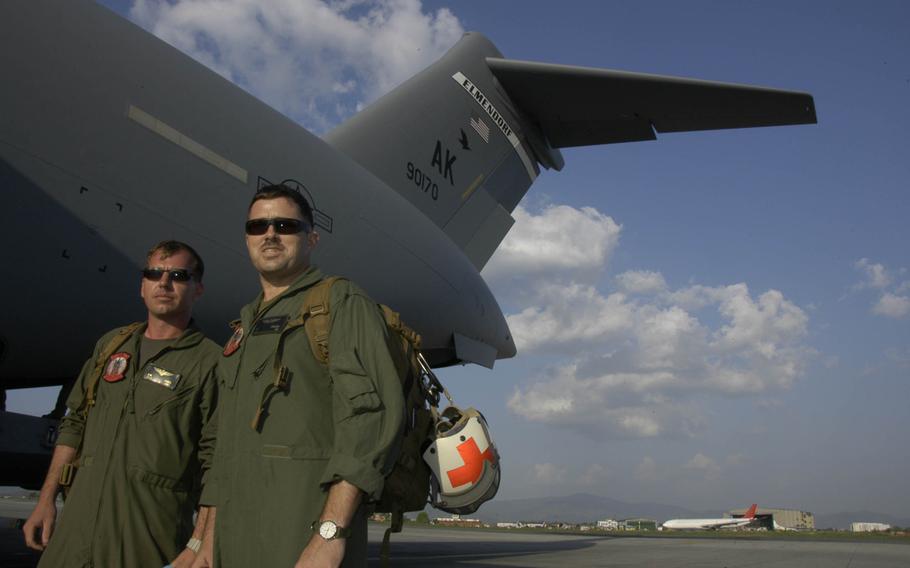 Marine Corps Huey pilot Capt. Duncan James,  left, 32, of Brady, Texas, and Navy flight surgeon Lt. Brendan McCluney, 34, of Los Angles, arrived in Kathmandu, Nepal, on an Air Force C-17 Sunday, May 3, 2015, as part of a U.S. military effort to aid in the earthquake relief. 
