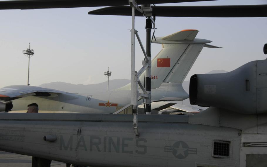 A Marine Corps HU-1 Huey helicopter sits on the tarmac at Kathmandu's airport on Sunday, May 3, 2014. The helicopter and other U.S. military aircraft arrived to assist with the disaster relief effort following the April 25 earthquake in Nepal.