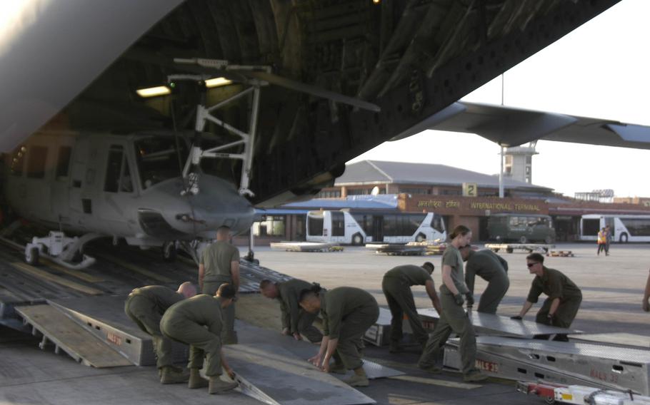 Marines unload an Air Force C-17 transport plane at Kathmandu, Nepal on Sunday, May 3, 2015. The U.S. brought in aircraft and troops to help with the earthquake relief effort.
