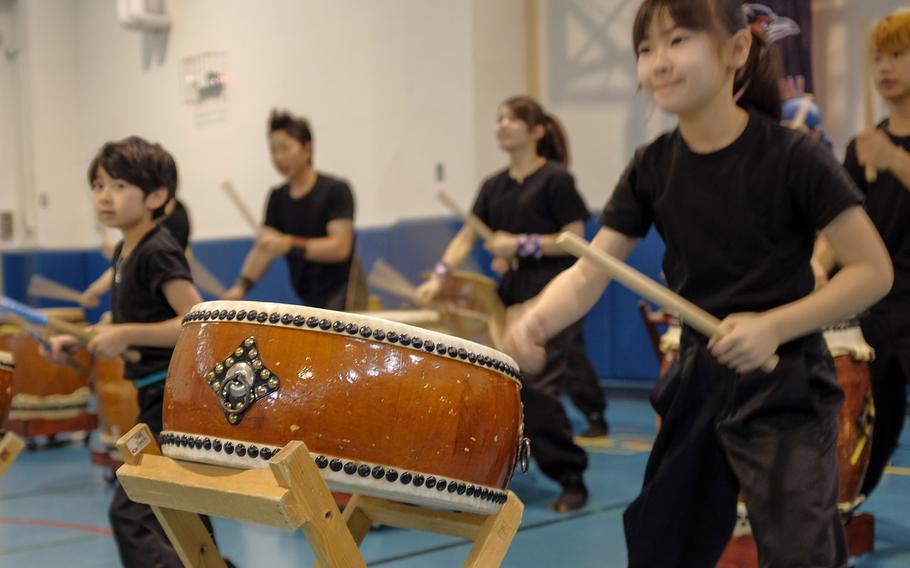 Taiko drummers from Oume Daiko, a local traditional Japanese drum club, demonstrate their art to students of Joan K. Mendel Elementary School May 5, 2015 during the school's annual cultural festival, JapANDasia at Yokota Air Base, Japan. More than 160 volunteers participated in the festival to teach the elementary school students about Japanese culture and language.