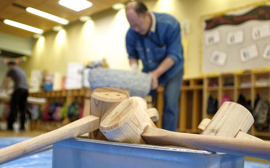 A Joan K. Mendel Elementary School volunteer cleans an "usu," or a bowl used for making the Japanese rice dessert mochi, May 5, 2015 following the school's annual cultural festival, JapANDasia. More than 160 volunteers participated in the festival to teach the elementary school students about Japanese culture and language.