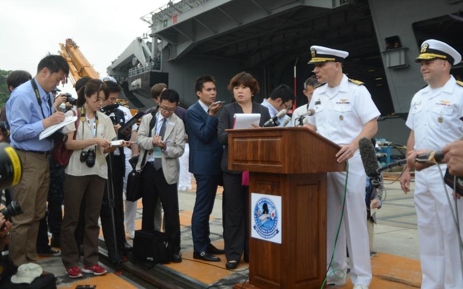 USS George Washington commanding officer Capt. Timothy Kuehhas and Carrier Strike Group 5 commander Rear Adm. John Alexander field questions from reporters Monday, May 18, 2015, about the carrier's departure. The George Washington, which has been based in Japan since 2008, is scheduled to be replaced by the USS Ronald Reagan later this fall.
