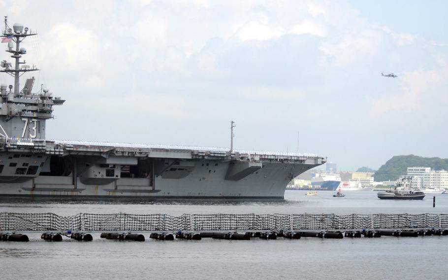 The aircraft carrier USS George Washington pulls out of port and leaves Japan for the final time Monday, May 18, 2015. The George Washington will begin patrolling the western Pacific and arrive in San Diego in August, where it will swap crews with the USS Ronald Reagan.