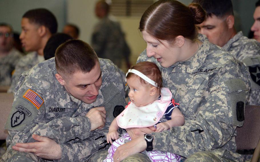 Sgt. Jeremy Chavarry entertains his baby, Evelyn, while his wife, Sgt. Helicia Chavarry, watches as they wait for Secretary of State John Kerry to arrive at Yongsan Garrison’s Collier Field House on Monday, May 18, 2015. The Chavarrys traveled four hours by bus to hear Kerry speak. 

