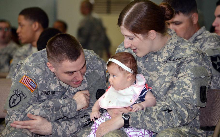 Sgt. Jeremy Chavarry entertains his baby, Evelyn, while his wife, Sgt. Helicia Chavarry, watches as they wait for Secretary of State John Kerry to arrive at Yongsan Garrison’s Collier Field House on Monday, May 18, 2015. The Chavarrys traveled four hours by bus to hear Kerry speak.