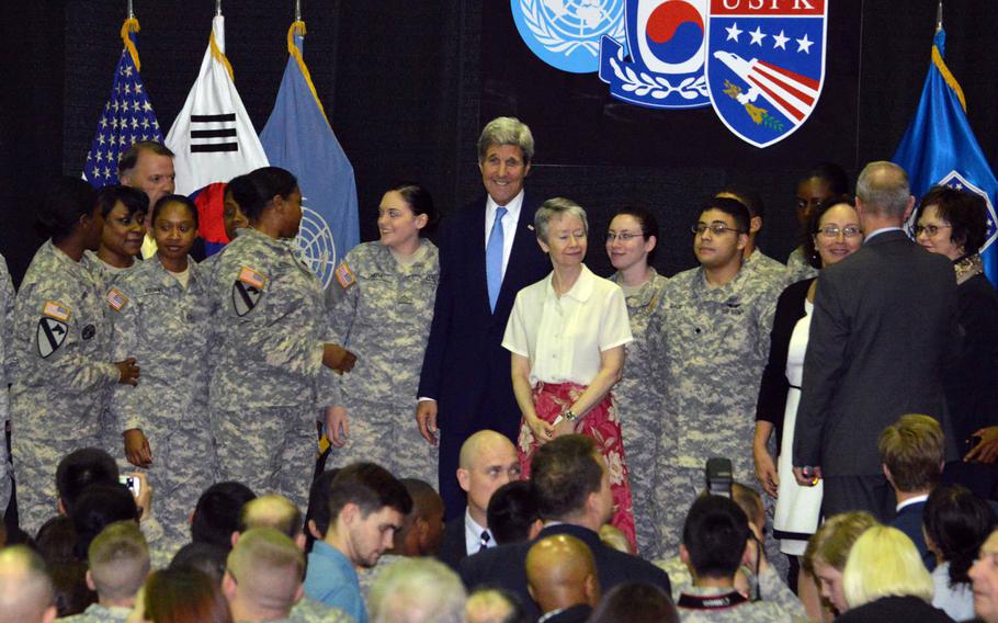 Secretary of State John Kerry poses with troops and civilian workers at Yongsan Garrison’s Collier Field House on Monday, May 18, 2015. Kerry call out North Korea for having what he described as the world’s most restrictive prohibitions on Internet usage.

