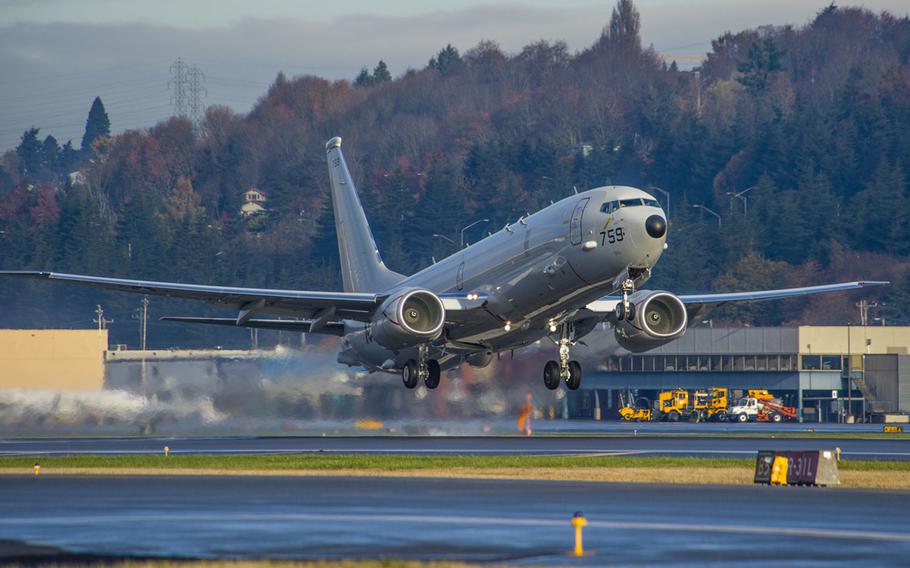 A P-8A Poseidon aircraft departs Boeing Field in Seattle on Nov. 20, 2014. A P-8 was patrolling what the U.S. considers international airspace over the South China Sea on May 20, 2015, when it was warned away by a Chinese navy ground dispatcher at Fiery Cross Reef. China considers the reef its territory.
