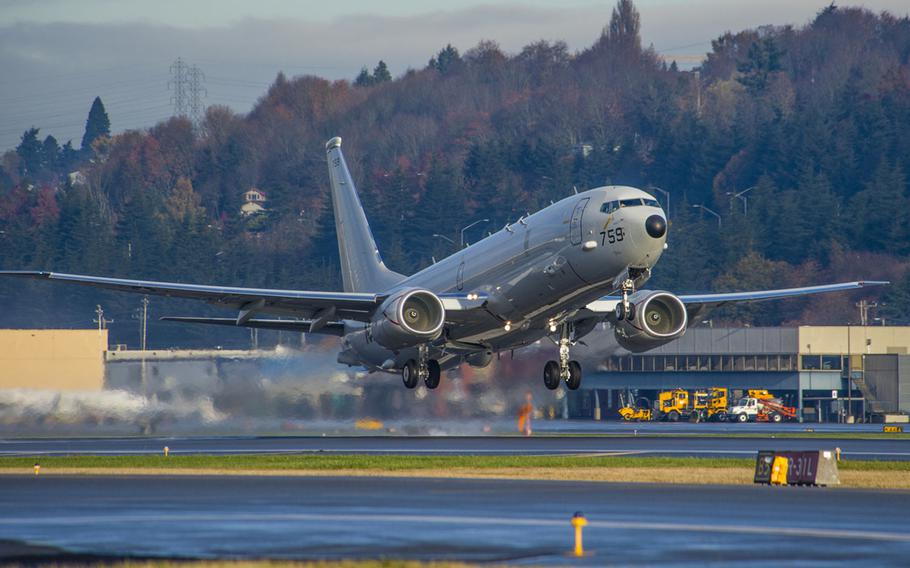 A P-8A Poseidon aircraft departs Boeing Field in Seattle on Nov. 20, 2014. A P-8 was patrolling what the U.S. considers international airspace over the South China Sea on May 20, 2015, when it was warned away by a Chinese navy ground dispatcher at Fiery Cross Reef. China considers the reef its territory.
