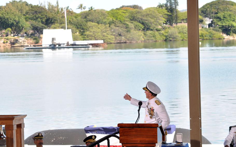 Adm. Jonathan W. Greenert, chief of naval operations, points out the backdrop of the USS Arizona Memorial for the change-of-command ceremony for fleet commander and Pacific command Wednesday, May 27, 2015, at Joint Base Pearl Harbor-Hickam, Hawaii.