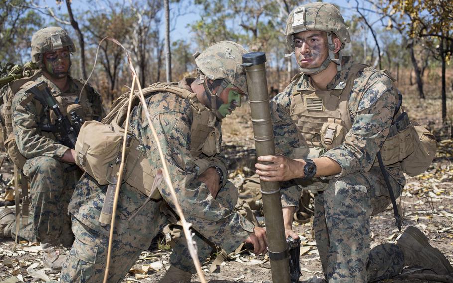 Lance Cpl. Alex Fuentes, left, and Lance Cpl. Joshua Trivino, of the 1st Battalion, 4th Marine Regiment, grasp a mortar during training at the Mount Bundey Training Area, Northern Territory, Australia, on May 23, 2014. The 1-4 Marines, who are in Australia on a six-month rotation, will join other U.S., New Zealand, Australian and Japanese forces for the Talisman Saber exercise to be held in July.


