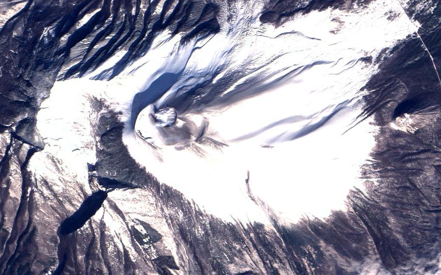 Mount Asama, an active volcano about 65 miles northwest of Yokota Air Base, Japan, is seen in this satellite image taken on the morning of Feb. 11, 2009, days after it last erupted.