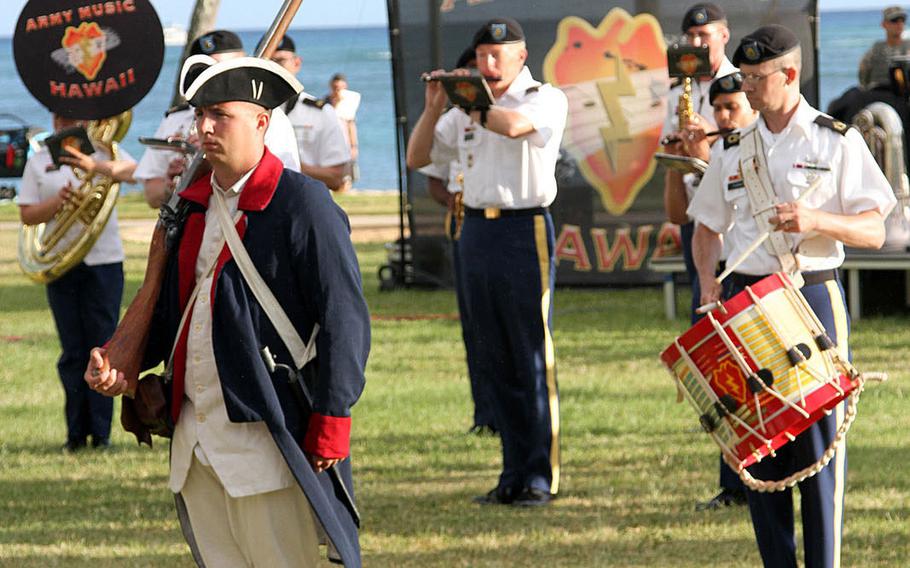 Volunteers in period uniforms perform during a musical presentation called 'Legacy of Honor' by the 25th Infantry Division band, June 9, 2015, at Fort DeRussy in Honolulu.