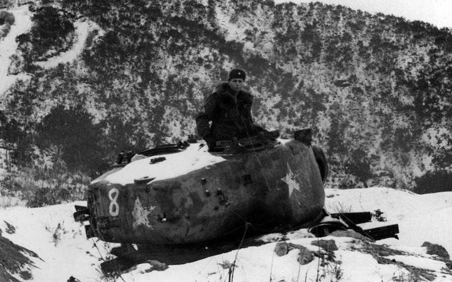 In this Army file photo from March 5, 1968, Sgt. Thomas P. Gilhooley of the 2nd Battalion, 9th Infantry Regiment stands in the rusting turret of the 'Iron King' tank of Easy Queen Mountains, South Korea. On July 2, 2015, units belonging to the 2nd Infantry Division's 1st Brigade Combat Team will inactivate, marking the end of more than 50 years on the peninsula.