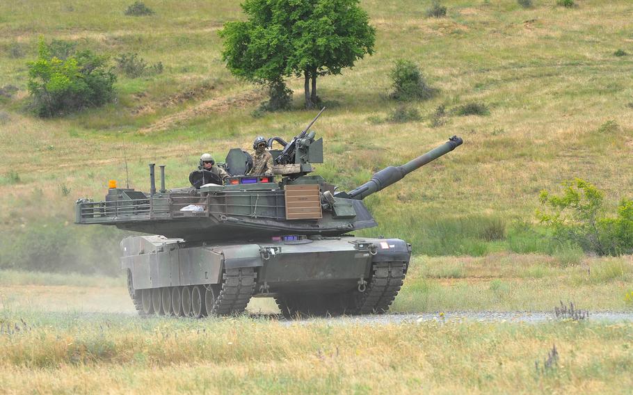 A U.S. Army M1A2 Abrams tank, manned by soldiers of the 3rd Combined Arms Battalion, 69th Armor Regiment, rumbles across Novo Selo Training Area, Bulgaria, following a live-fire exercise on Thursday June 25, 2015. Concerns over Russia's incursion into Ukraine may be one of the reasons that Europe was spared cuts announced by the U.S. Army on Thursday.