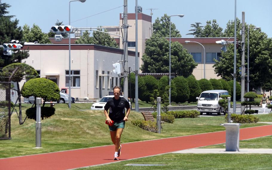 A man runs the track on Yokota Air Base in Japan on July 14, 2015. The base elevated its heat category to red recommending members of the base to limit outdoor activities to 30 minutes per hour or less. 