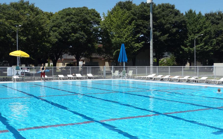 A lifeguard prepares for the crowds expected at Sakana Pool on Yokota Air Base on July 14, 2015. 