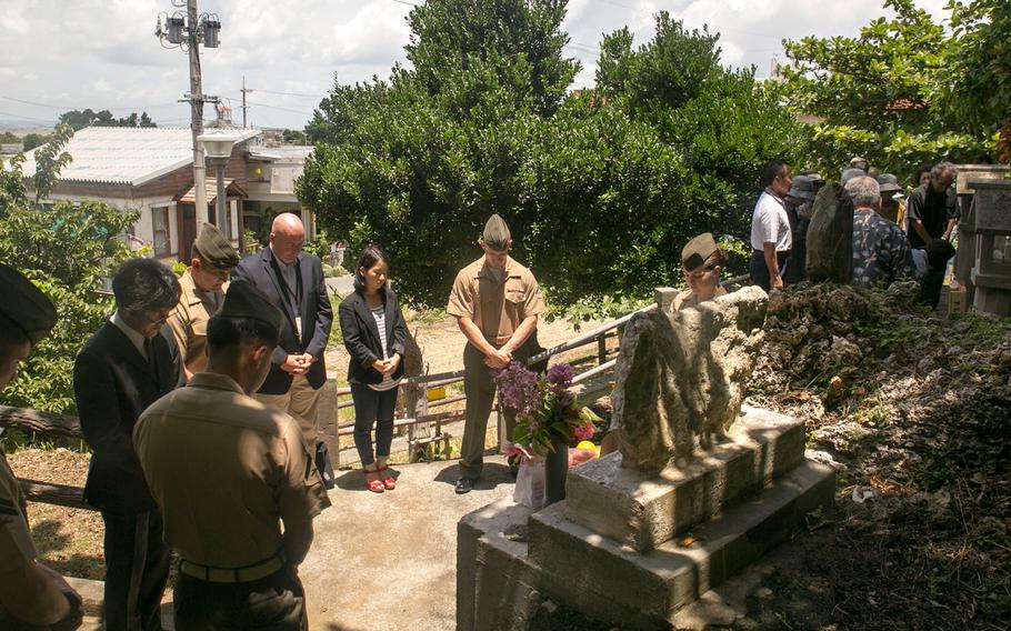 In this file photo from June 23, 2014, Marines and local community members pay respects to Col. Kermit Shelly and those who died during the Battle of Okinawa on Hamahiga Island. The contributions Shelly and his Marines made to Hamahiga were so appreciated by the community that a memorial was constructed for him and maintained following his death.