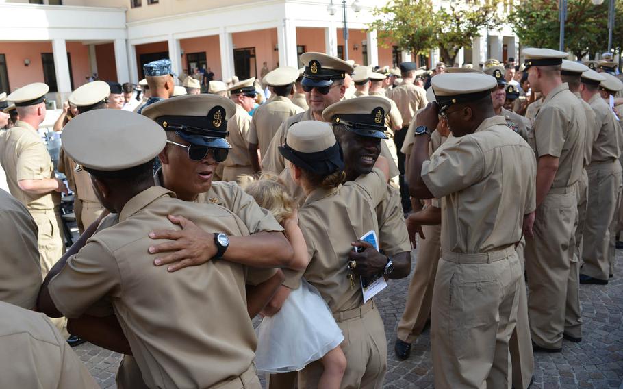 Chief petty officers congratulate newly pinned chiefs after a pinning ceremony, Wednesday, Sept. 16, 2015, at the U.S. naval base in Naples, Italy.

