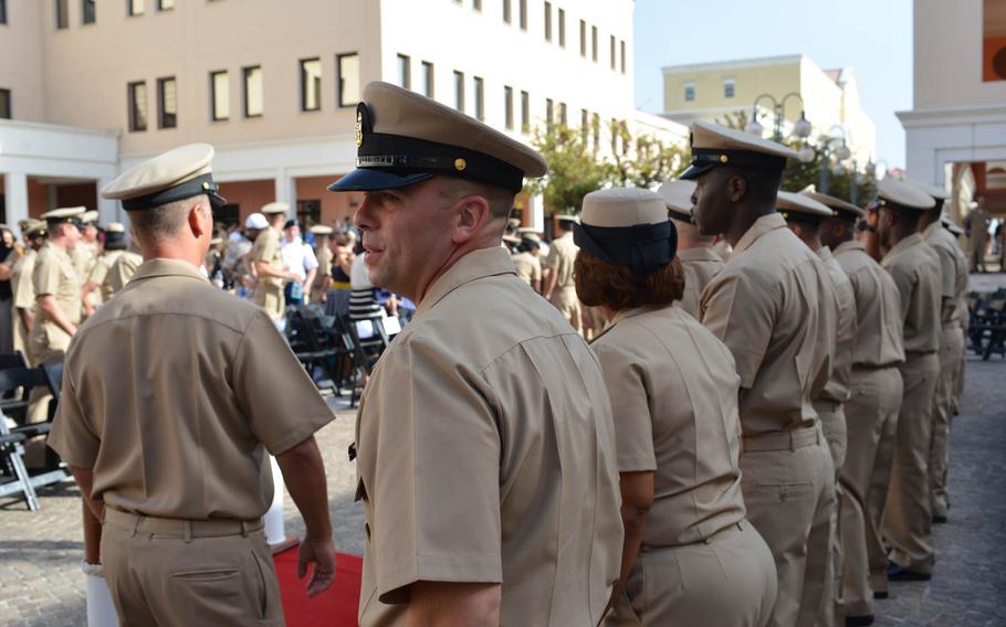 Chief Petty Officer John Wheeler waits in the receiving line after a pinning ceremony Wednesday, Sept. 16, 2015, at the U.S. naval base in Naples, Italy. 

