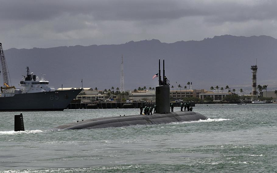 The Los Angeles-class submarine USS Tucson departs Joint Base Pearl Harbor-Hickam for a scheduled deployment to the western Pacific region in 2010. A new report by Rand Corp. said the United States should decrease its emphasis on large aircraft carriers in the Pacific and spend more on submarines.