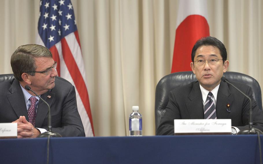 Secretary of Defense Ash Carter listens as Japan's Minister for Foreign Affairs Fumio Kishida makes brief remarks during a signing ceremony of the "Agreement to Supplement the Japan-U.S. Status of Forces Agreement (SOFA) on Environmental Stewardship" at the Pentagon Sept. 24, 2015. 
