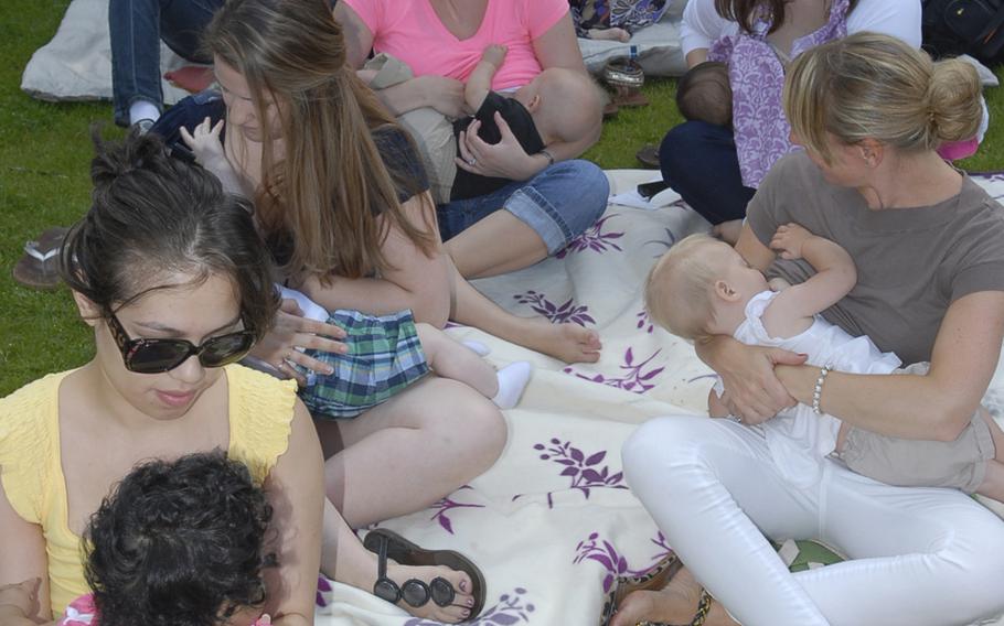 Dozens of mothers nurse their children at Ramstein Air Base in 2012 as part of the Big Latch On, a global effort to raise awareness of the health benefits of breast-feeding held during World Breast-feeding Week.   The Army has issued a policy requiring that soldiers be given time to breast-feed and express milk on the job, making it the final branch of service to adopt a policy.